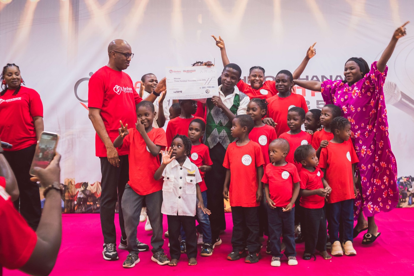 Children and Lifeshare Foundation team celebrating an award at The Orphanage Talent Fest 2025