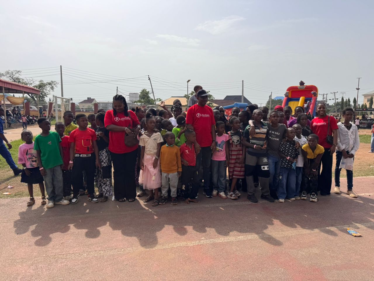 Lifeshare Foundation volunteers with children during community outreach